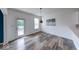 Bright dining area featuring modern flooring and pendant lighting next to the kitchen at 7212 Maple Bluff Pl, Indianapolis, IN 46236