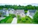 Charming two-story home with mature trees in front and a glimpse of a pond in the back at 7212 Maple Bluff Pl, Indianapolis, IN 46236