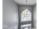 Bright foyer featuring a large decorative chandelier and vaulted ceilings at 7212 Maple Bluff Pl, Indianapolis, IN 46236