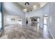 Spacious living room with high ceilings, beautiful archways, and gorgeous wood flooring throughout the area at 7212 Maple Bluff Pl, Indianapolis, IN 46236