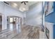 Spacious living room featuring tall ceilings, a fireplace, and arched doorways at 7212 Maple Bluff Pl, Indianapolis, IN 46236