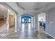 Open concept living room with beautiful flooring, arches, and great natural light at 7212 Maple Bluff Pl, Indianapolis, IN 46236