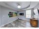 Comfortable living space with hardwood floors, recessed lighting, and a modern TV set for entertainment at 7212 Maple Bluff Pl, Indianapolis, IN 46236