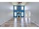 Spacious living room featuring a fireplace, high ceilings, and large windows at 7212 Maple Bluff Pl, Indianapolis, IN 46236
