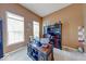 Bright and airy office space with carpeted floors, a desk and bookshelves, and plenty of natural light at 7212 Maple Bluff Pl, Indianapolis, IN 46236