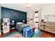 bedroom with built-in shelves, charming decor, and a large window at 7242 Highburry Dr, Indianapolis, IN 46256