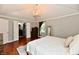 Spacious main bedroom with a chandelier, closet and an open door to the bathroom at 7242 Highburry Dr, Indianapolis, IN 46256