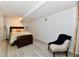 A bedroom featuring a bed with decorative bedding and a chair at 7242 Highburry Dr, Indianapolis, IN 46256
