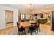 Open-concept floor plan featuring a dining area leading to the foyer and the living room at 7242 Highburry Dr, Indianapolis, IN 46256