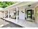 Inviting front porch with a seating area perfect for enjoying the outdoors at 7242 Highburry Dr, Indianapolis, IN 46256