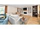 Inviting living room features a fireplace, custom built-ins, and a large comfortable sectional sofa at 7242 Highburry Dr, Indianapolis, IN 46256