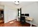 Bright office space with dual monitors, wood floors, and a double door closet at 7242 Highburry Dr, Indianapolis, IN 46256