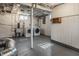 Unfinished basement with white-painted walls and ceiling, including a laundry area with side-by-side washer and dryer at 743 Sanders St, Indianapolis, IN 46203