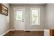 Simple entryway with hardwood floors, neutral walls, and natural light from the window at 743 Sanders St, Indianapolis, IN 46203