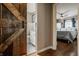 Hallway with a view of a rustic barn door leading to a bathroom and a bedroom at 743 Sanders St, Indianapolis, IN 46203