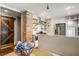 Modern kitchen featuring a brick column, floating shelves, stainless steel appliances, and granite countertops at 743 Sanders St, Indianapolis, IN 46203