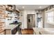 Bright kitchen features open shelving, white cabinets, subway tile backsplash, and stainless steel appliances at 743 Sanders St, Indianapolis, IN 46203