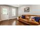 Inviting living room with a leather sofa, hardwood floors, and ample natural light at 743 Sanders St, Indianapolis, IN 46203