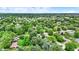 A detailed aerial perspective of a neighborhood featuring mature trees and manicured lawns surrounding attractive single-Gathering homes at 7504 Troon Ct, Indianapolis, IN 46237