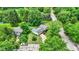 Aerial view captures a home surrounded by lush greenery, showcasing its charming neighborhood location and curb appeal at 7504 Troon Ct, Indianapolis, IN 46237
