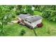 Aerial view of a charming home featuring vinyl siding, brick accents, and a nicely landscaped yard at 7504 Troon Ct, Indianapolis, IN 46237