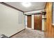 Finished basement with neutral carpet and wood-paneled wall, offering flexible living space at 7504 Troon Ct, Indianapolis, IN 46237