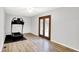 Spacious bedroom featuring wood floors, ceiling fan, and natural lighting at 7504 Troon Ct, Indianapolis, IN 46237
