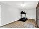 Large bedroom featuring wood-style floors, a ceiling fan, and lots of sunlight at 7504 Troon Ct, Indianapolis, IN 46237