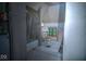 View of a bathroom with laundry hookups, tub, and toilet at 783 Woodruff Place Middle Dr, Indianapolis, IN 46201