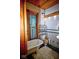 View of a bathroom that includes a tub, toilet, sink, and window at 783 Woodruff Place Middle Dr, Indianapolis, IN 46201