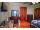 Bedroom with hardwood floors and a stylish wooden dresser and mirror at 783 Woodruff Place Middle Dr, Indianapolis, IN 46201