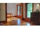 Bedroom featuring hardwood floors, wooden trim, and an abundance of natural light at 783 Woodruff Place Middle Dr, Indianapolis, IN 46201