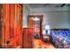Bedroom with hardwood floors, wooden trim, and a closet with wood slat shelves at 783 Woodruff Place Middle Dr, Indianapolis, IN 46201