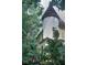Unique architectural design featuring a turret and lush greenery surrounding the property at 783 Woodruff Place Middle Dr, Indianapolis, IN 46201