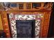 A beautifully crafted fireplace with wooden mantel and decorative tiles at 783 Woodruff Place Middle Dr, Indianapolis, IN 46201