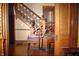 A view of the foyer showing the staircase and decorative woodwork in a traditional style home at 783 Woodruff Place Middle Dr, Indianapolis, IN 46201