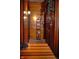 Hallway with natural wood paneling and built-in shelving at 783 Woodruff Place Middle Dr, Indianapolis, IN 46201