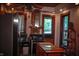 Bright kitchen with stainless steel appliances and brick accents at 783 Woodruff Place Middle Dr, Indianapolis, IN 46201