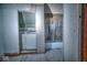View of a laundry room that leads to a bathroom with a tub at 783 Woodruff Place Middle Dr, Indianapolis, IN 46201