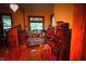 Comfortable living room featuring hardwood floors, a chandelier, and stained glass window at 783 Woodruff Place Middle Dr, Indianapolis, IN 46201