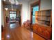 Open living room with hardwood floors, vintage furniture, and lots of natural light at 783 Woodruff Place Middle Dr, Indianapolis, IN 46201