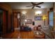 Cozy living room featuring hardwood floors, ceiling fan, and vintage decor at 783 Woodruff Place Middle Dr, Indianapolis, IN 46201