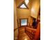 View of the staircase showcasing the wood craftsmanship, window, and chandelier at 783 Woodruff Place Middle Dr, Indianapolis, IN 46201