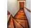 A close up view of a wooden staircase leading up to a door at 783 Woodruff Place Middle Dr, Indianapolis, IN 46201