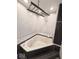 Bathroom with a corner jacuzzi tub, white subway tile backsplash, and a wooden towel rack at 8990 N 850 W, Fairland, IN 46126