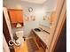Cozy bathroom with decorative accents, a sink, and standard toilet at 8990 N 850 W, Fairland, IN 46126