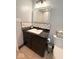 Bathroom with a modern sink, white subway tile backsplash, and a dark vanity at 8990 N 850 W, Fairland, IN 46126