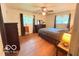 Comfortable bedroom with hardwood floors, natural light, and cozy decor at 8990 N 850 W, Fairland, IN 46126