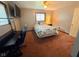 Cozy bedroom featuring a comfortable bed, study desk, and natural light from the window at 8990 N 850 W, Fairland, IN 46126