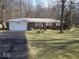 Charming single-story home with a brick facade, attached garage, and a well-maintained front yard at 8990 N 850 W, Fairland, IN 46126